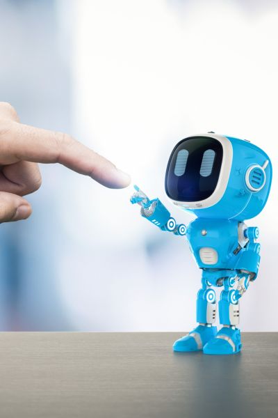 MP 399 Email Image 2 tiny robot touching a person's finger
