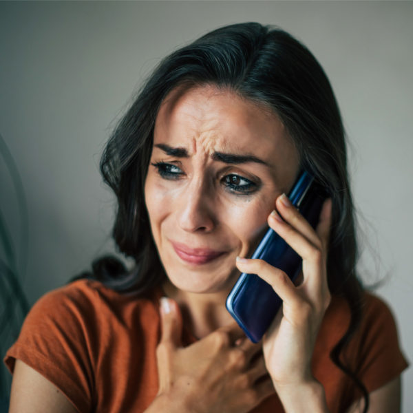 woman crying on phone